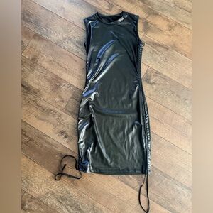 Sleek Black Faux Leather fitted dress w/ ruching on both sides.Very flattering!